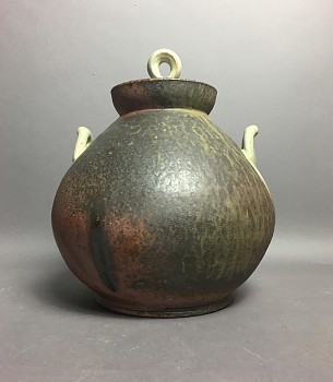 brown jar with blue handles